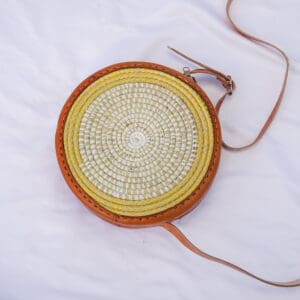 A round bag with a yellow and orange pattern on it.