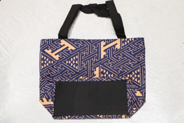 A bag with an orange and blue pattern on it.