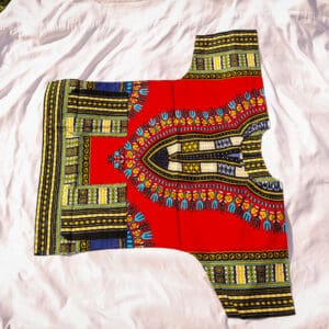 A red and yellow shirt with an african print.