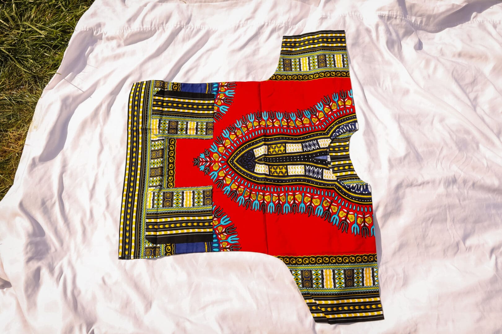 A red and yellow shirt with an african print.