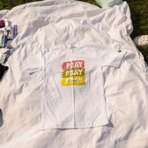 A white shirt that says pray pray pray