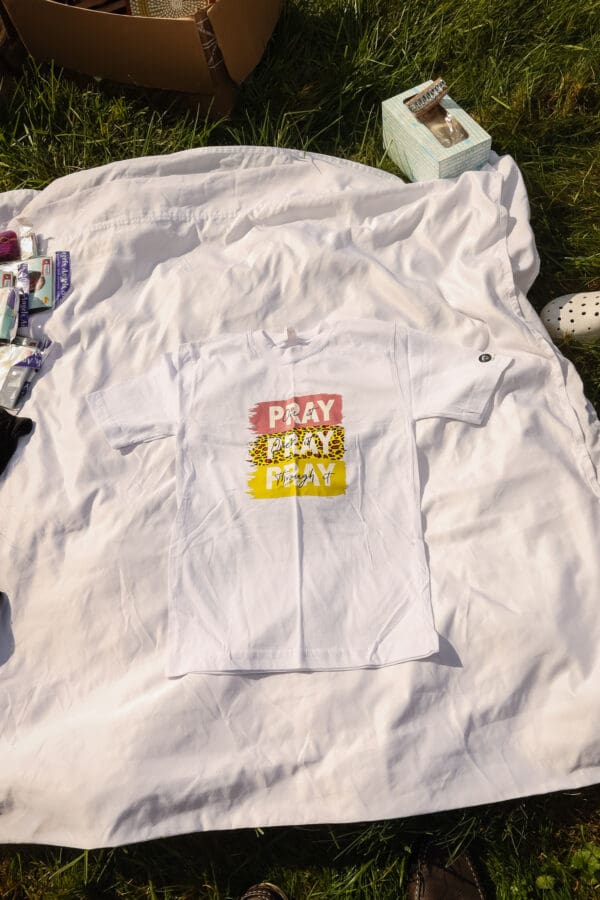 A white shirt that says pray pray pray